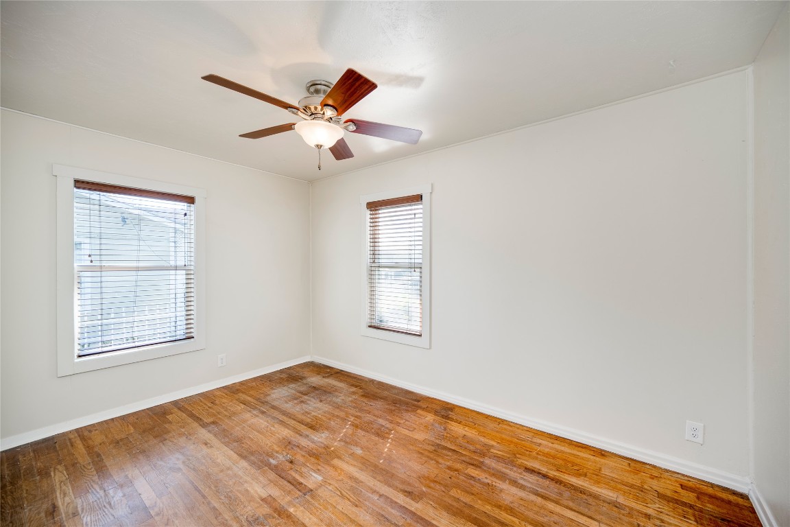 4804 Tanney Street Austin, TX 78721 - Photo 32 of 35 a view of empty room with wooden floor and fan