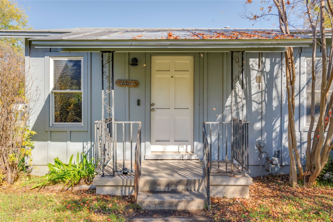 4804 Tanney Street Austin, TX 78721 - Photo 5 of 35 a front view of a house with a glass door