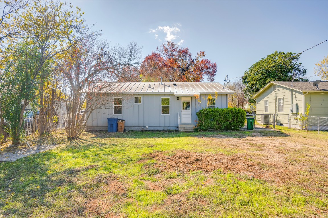 4804 Tanney Street Austin, TX 78721 - Photo 10 of 35 a front view of a house with a yard and garage