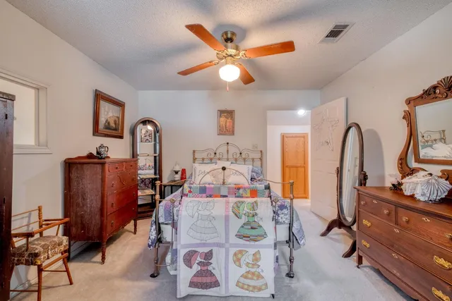 a bed room with furniture and a window