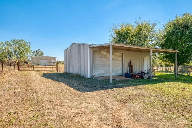 a view of a backyard of the house