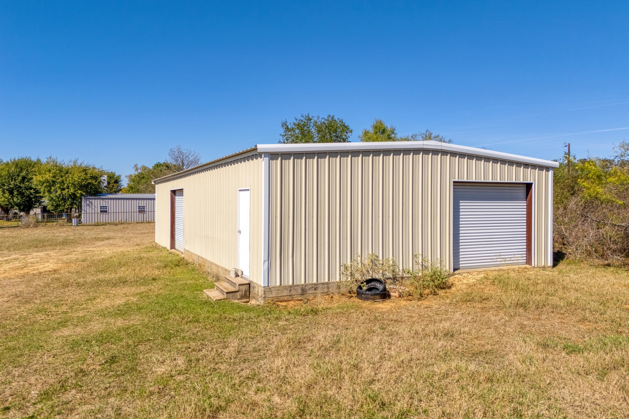 153 Pleasant Grove Road Elgin, TX 78621 - Photo 28 of 34 View of detached garage