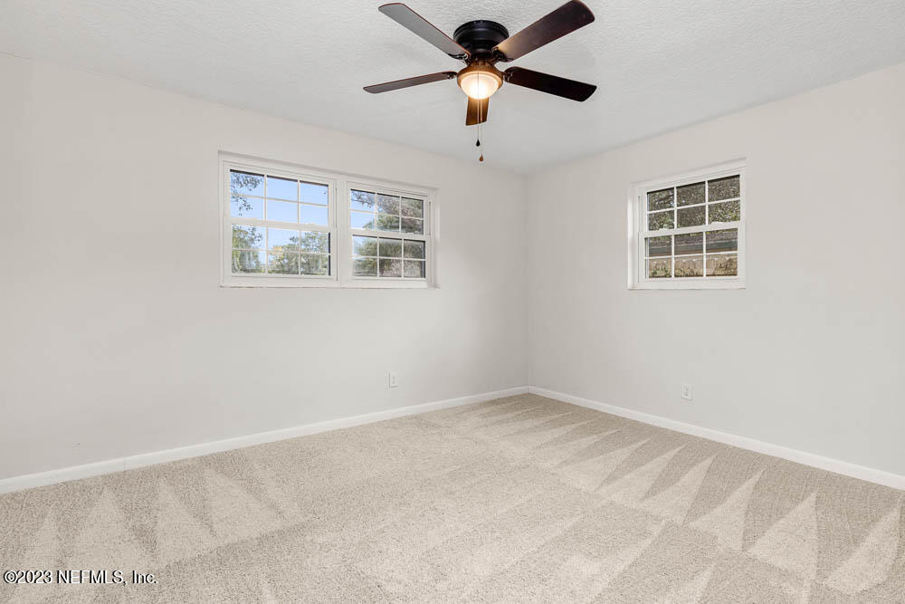 4066 Ferrarra Street Jacksonville, FL 32217 - Photo 16 of 25 a view of an empty room with a window