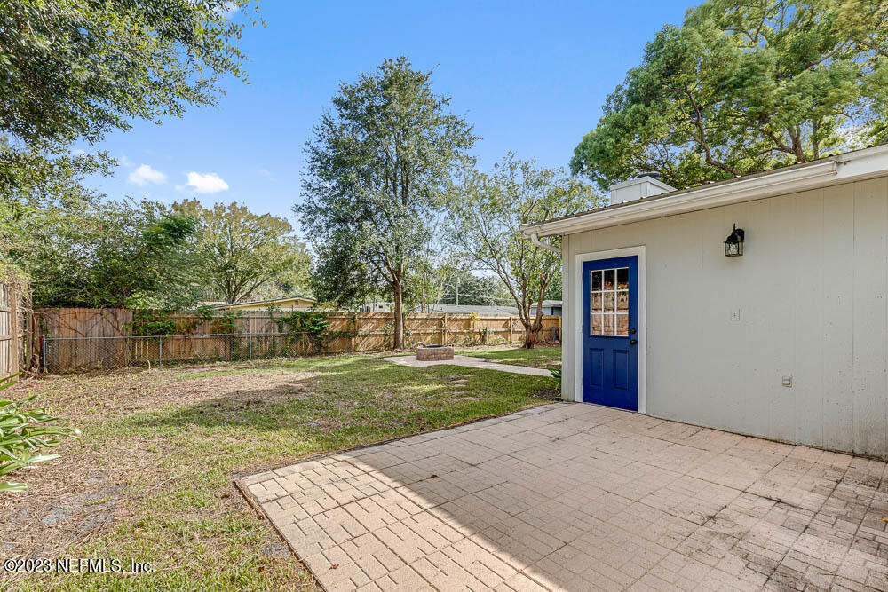 4066 Ferrarra Street Jacksonville, FL 32217 - Photo 22 of 25 a front view of a house with a yard