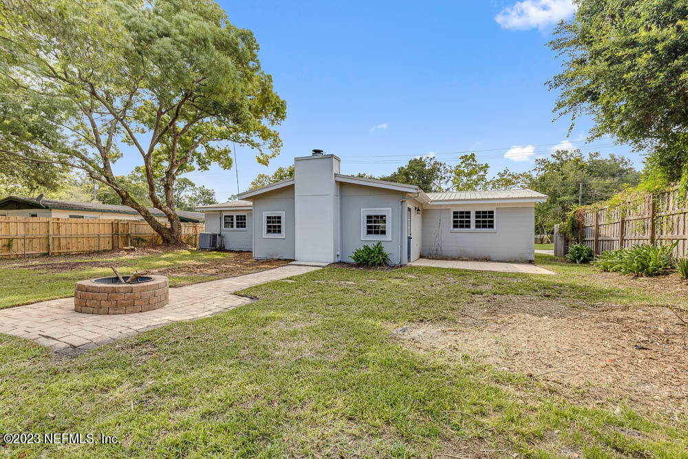 4066 Ferrarra Street Jacksonville, FL 32217 - Photo 23 of 25 a view of a house with backyard and sitting area