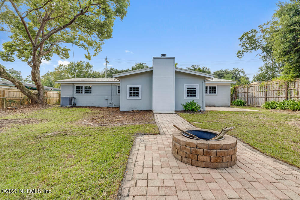 4066 Ferrarra Street Jacksonville, FL 32217 - Photo 24 of 25 a view of house with yard and seating area