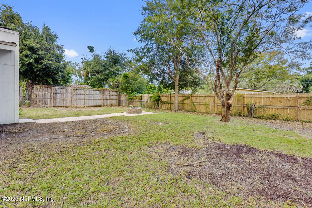 4066 Ferrarra Street Jacksonville, FL 32217 - Photo 25 of 25 a view of a yard with a tree