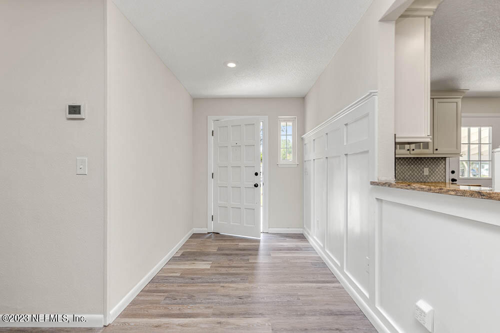 4066 Ferrarra Street Jacksonville, FL 32217 - Photo 3 of 25 a view of a kitchen from the hallway