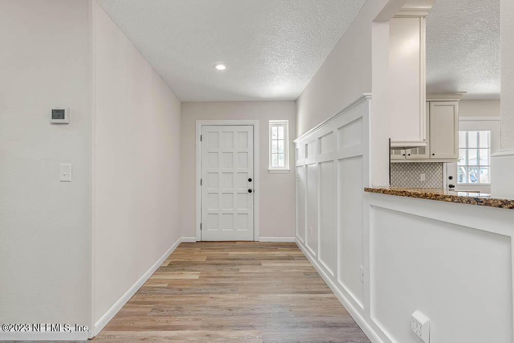 4066 Ferrarra Street Jacksonville, FL 32217 - Photo 8 of 25 a view of a kitchen from the hallway