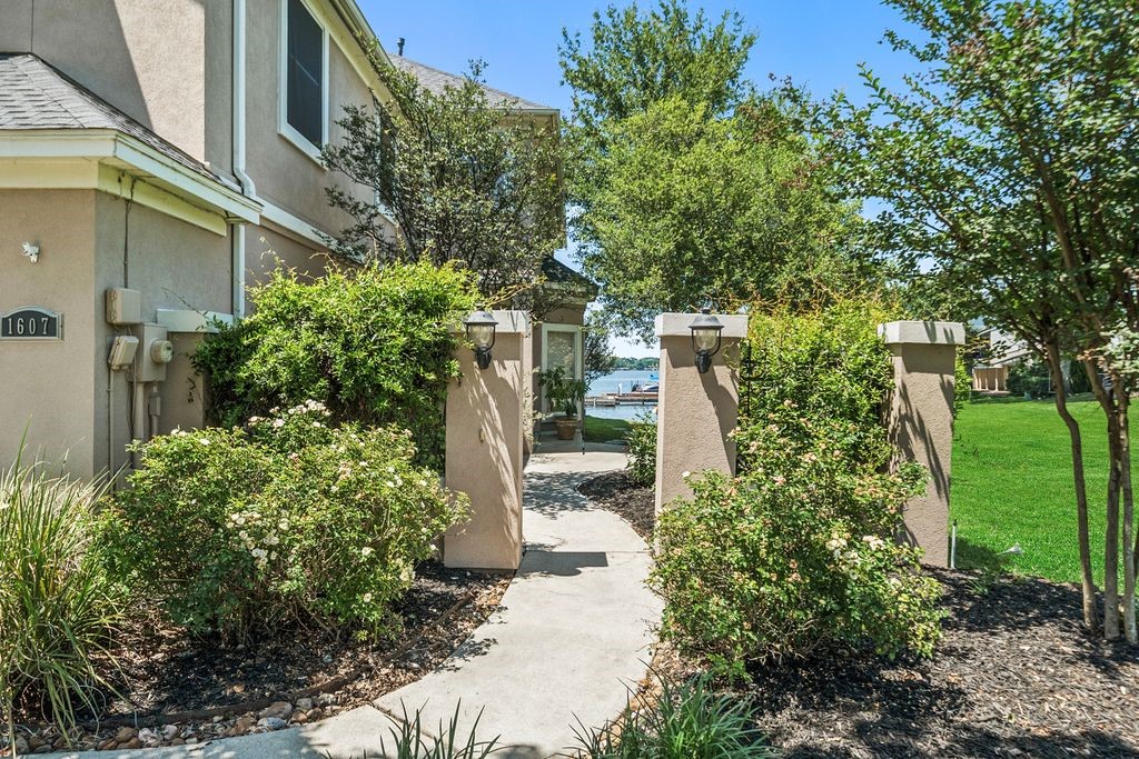 1607 Schooner Point Willis, TX 77318 - Photo 3 of 47 Lovely landscaped pathway leading to the front door.