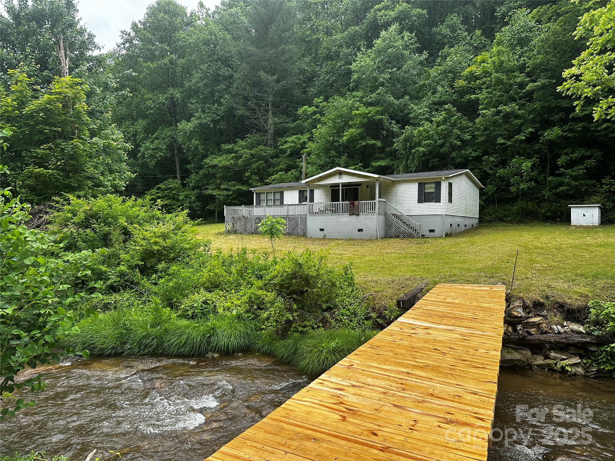 731 Pigeon Roost Road Green Mountain, NC 28740 - Photo 1 of 31 a view of a house with pool