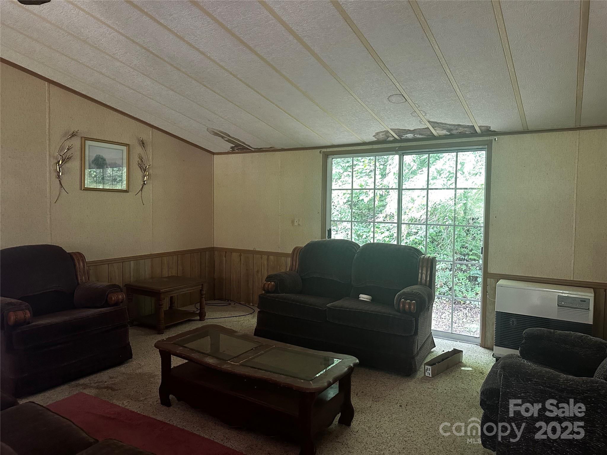 731 Pigeon Roost Road Green Mountain, NC 28740 - Photo 13 of 31 a living room with furniture and a window