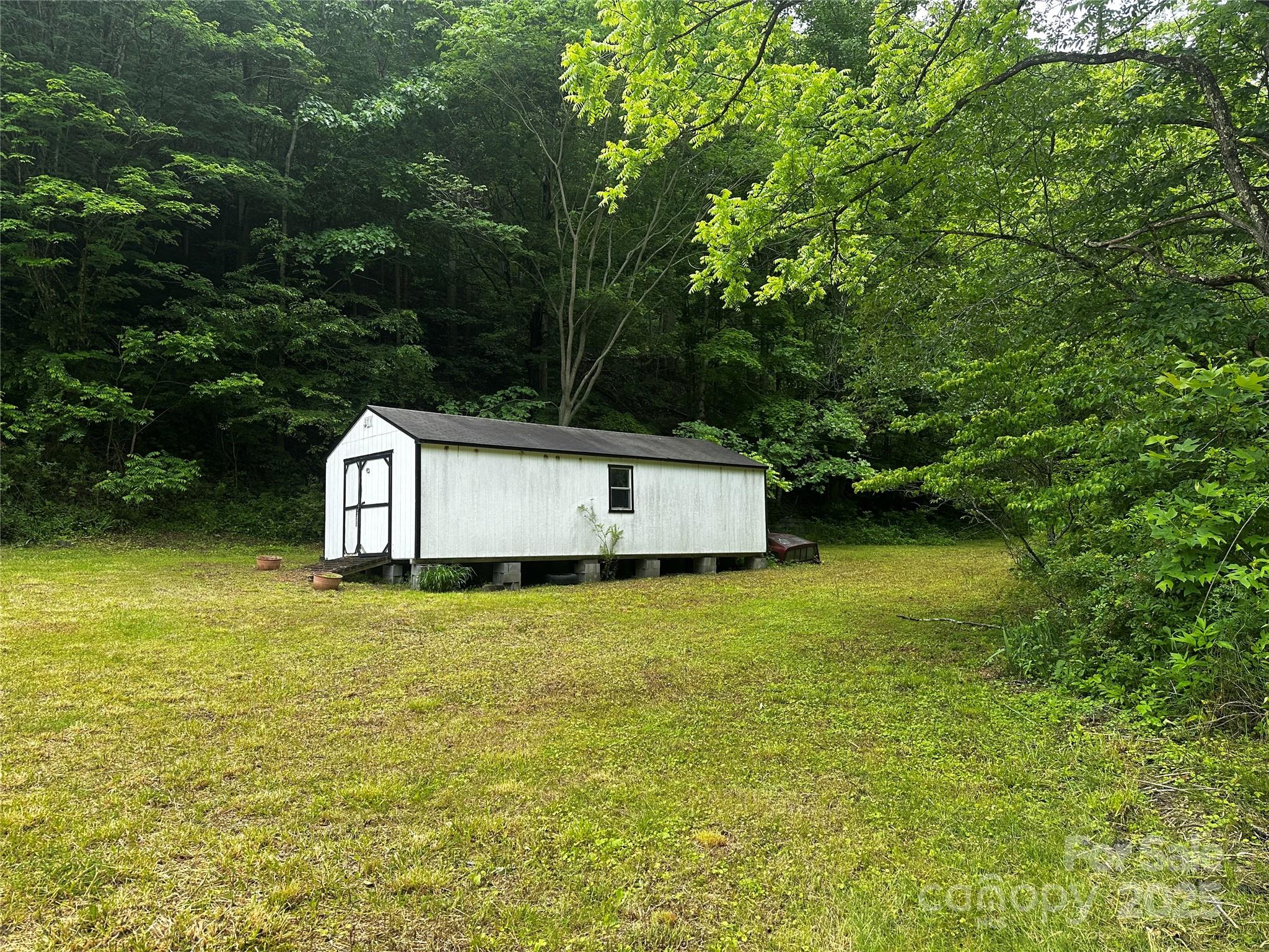 731 Pigeon Roost Road Green Mountain, NC 28740 - Photo 16 of 31 a house view with a outdoor space