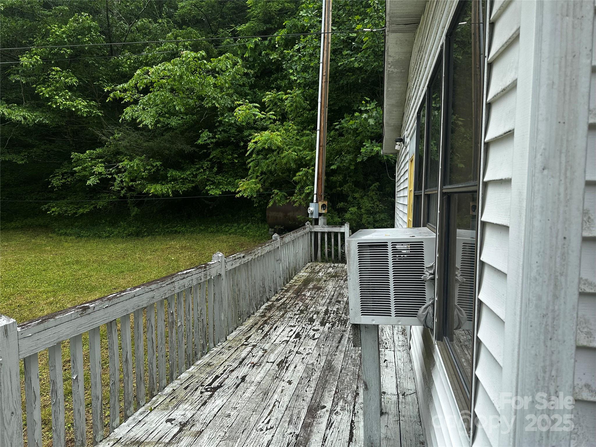 731 Pigeon Roost Road Green Mountain, NC 28740 - Photo 19 of 31 a view of a balcony with lake view and wooden floor