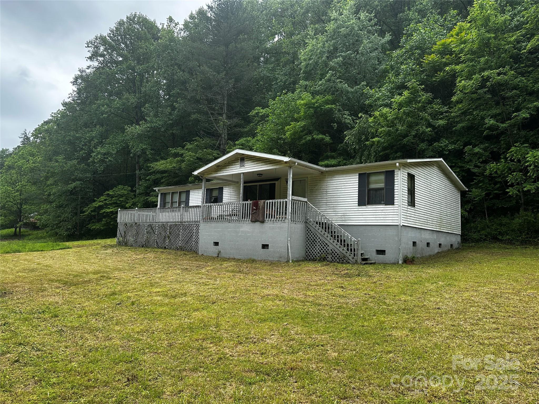 731 Pigeon Roost Road Green Mountain, NC 28740 - Photo 25 of 31 a house view with a outdoor space