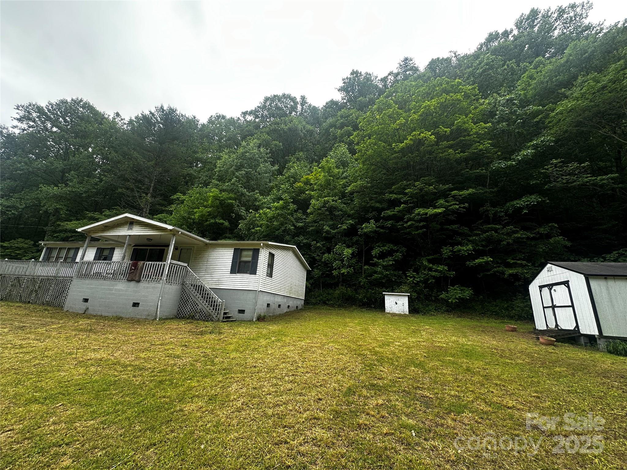 731 Pigeon Roost Road Green Mountain, NC 28740 - Photo 30 of 31 a front view of a house with garden