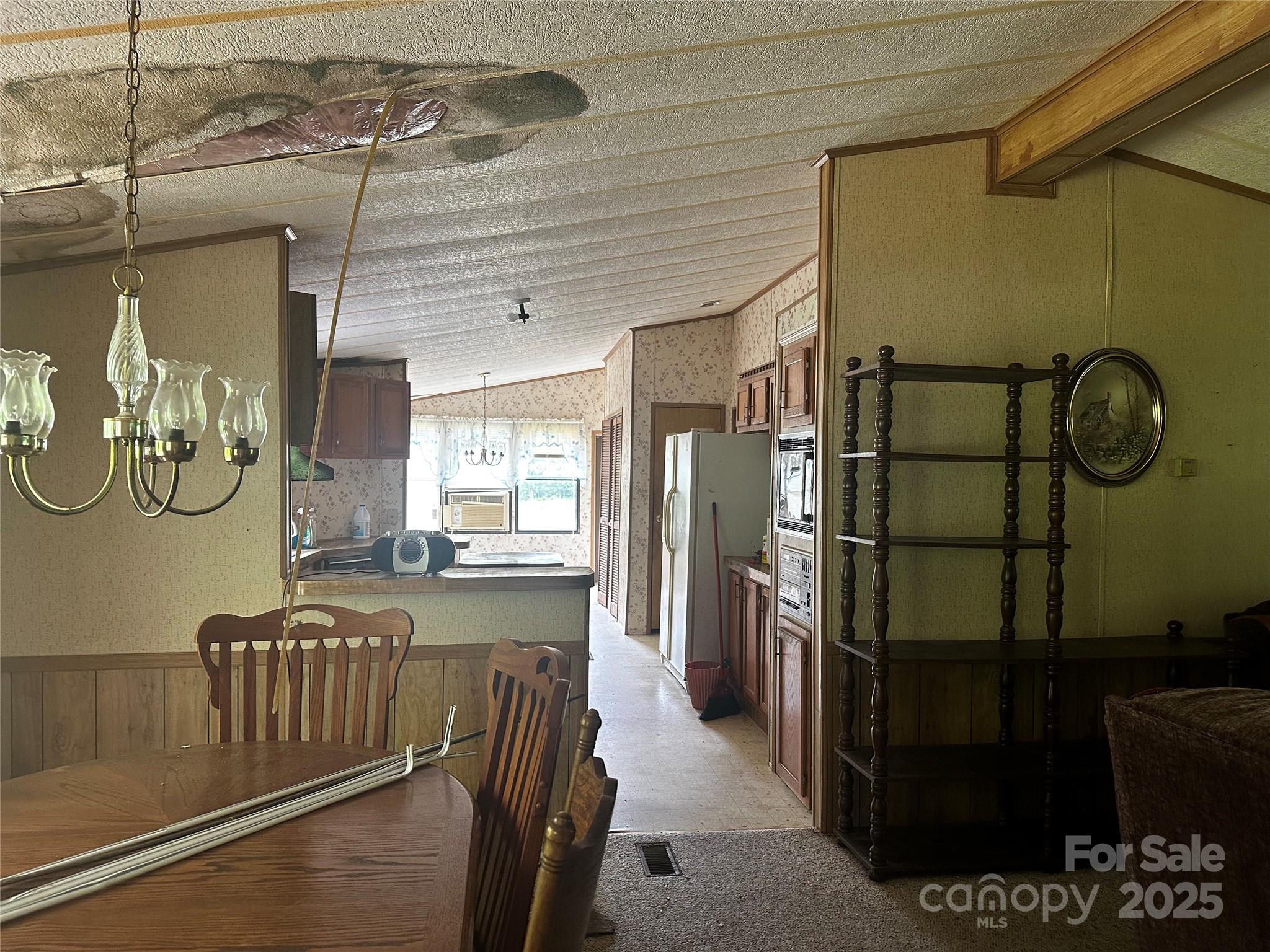 731 Pigeon Roost Road Green Mountain, NC 28740 - Photo 4 of 31 a kitchen with refrigerator and window