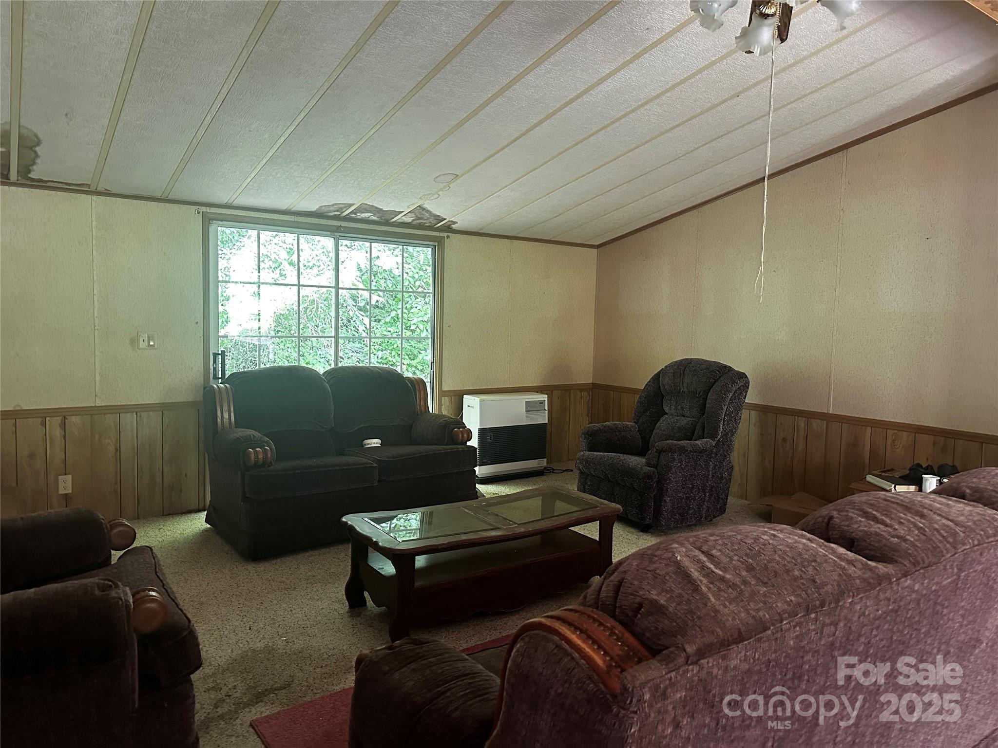 731 Pigeon Roost Road Green Mountain, NC 28740 - Photo 8 of 31 a living room with furniture and a window
