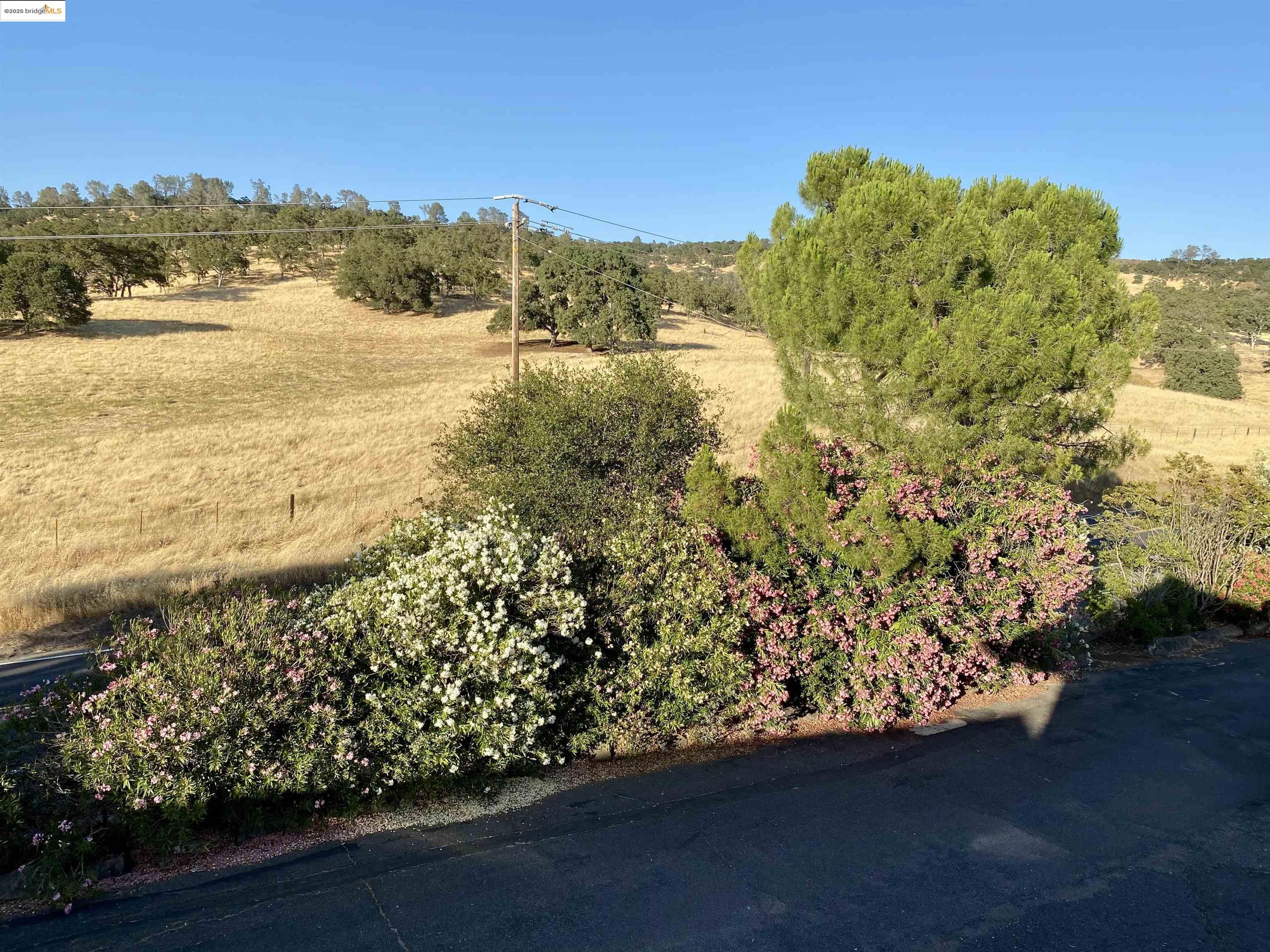 75 Poker Flat Road Copperopolis, CA 95228 - Photo 11 of 50 a view of a lake with a mountain