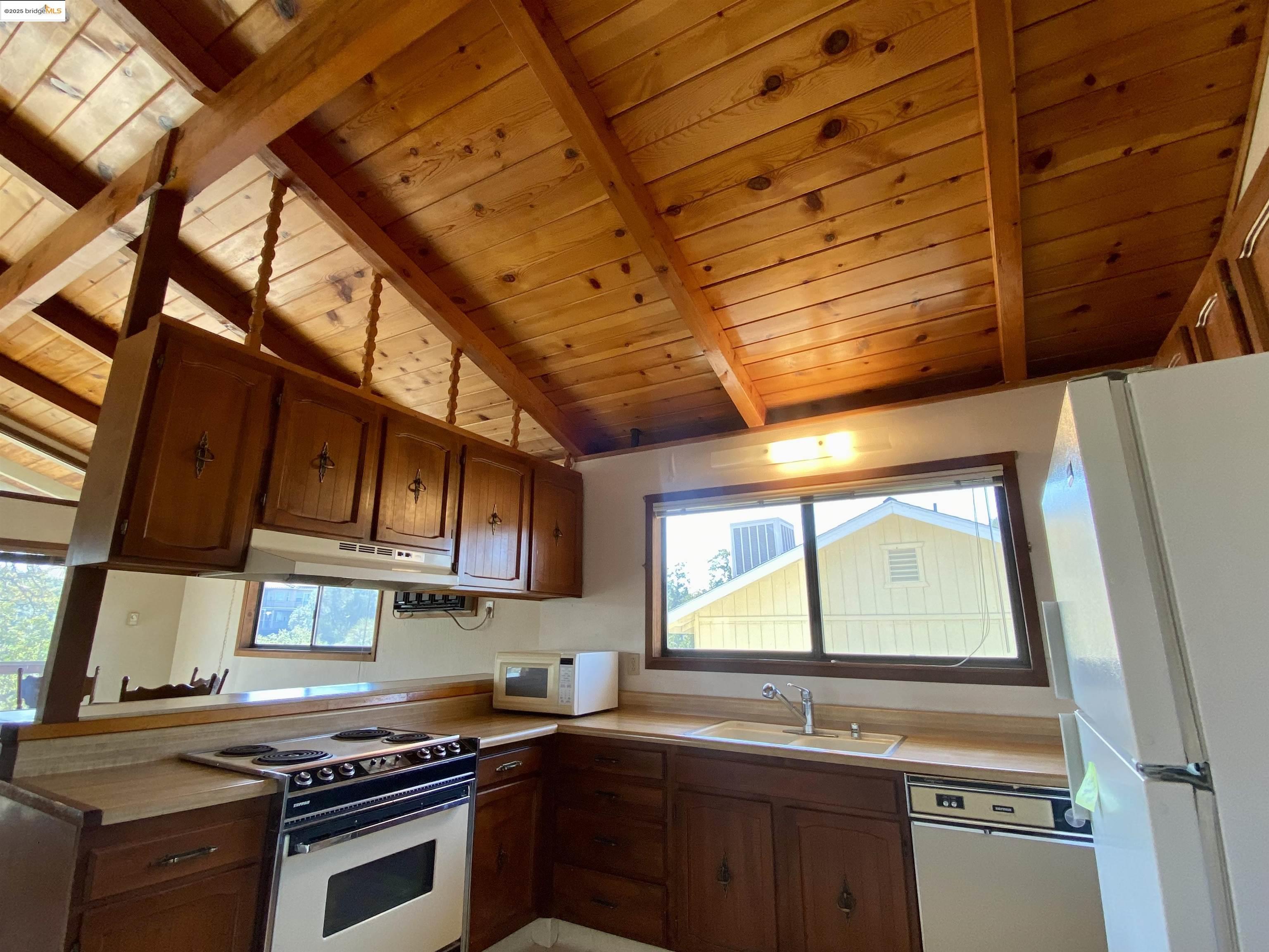 75 Poker Flat Road Copperopolis, CA 95228 - Photo 19 of 50 a kitchen with stainless steel appliances a sink dishwasher a stove and a microwave oven