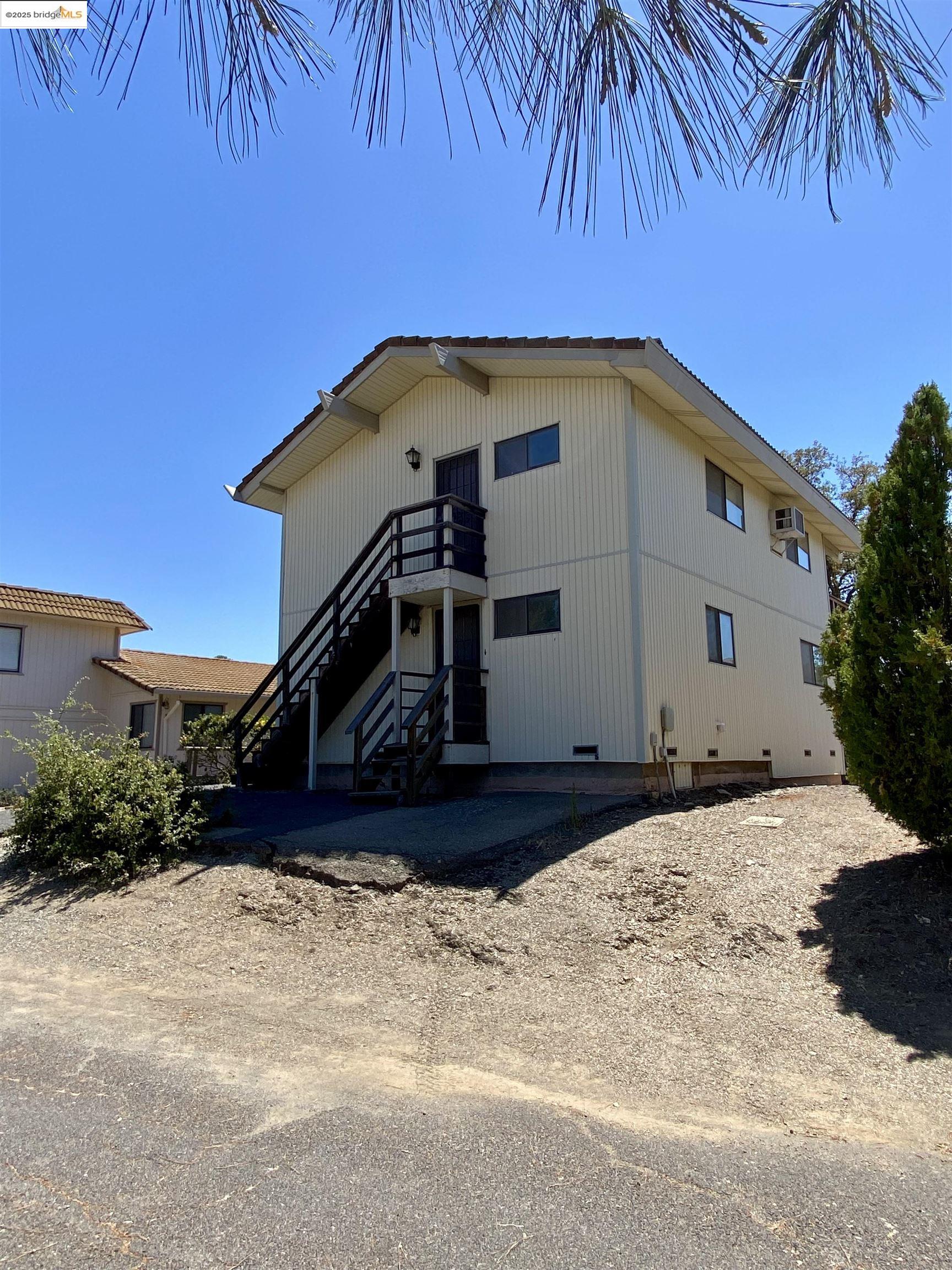 75 Poker Flat Road Copperopolis, CA 95228 - Photo 2 of 50 a front view of a house with a yard