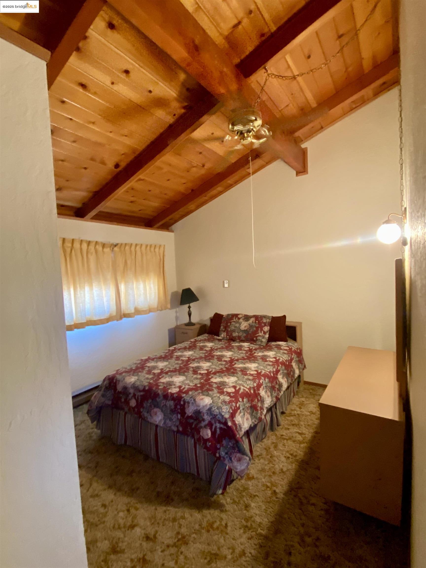 75 Poker Flat Road Copperopolis, CA 95228 - Photo 22 of 50 a bed sitting in a bedroom next to a window