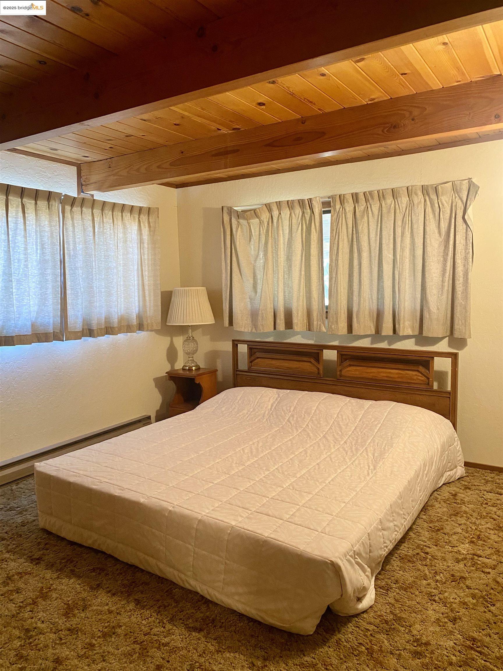 75 Poker Flat Road Copperopolis, CA 95228 - Photo 29 of 50 a bed sitting in a bedroom next to a window