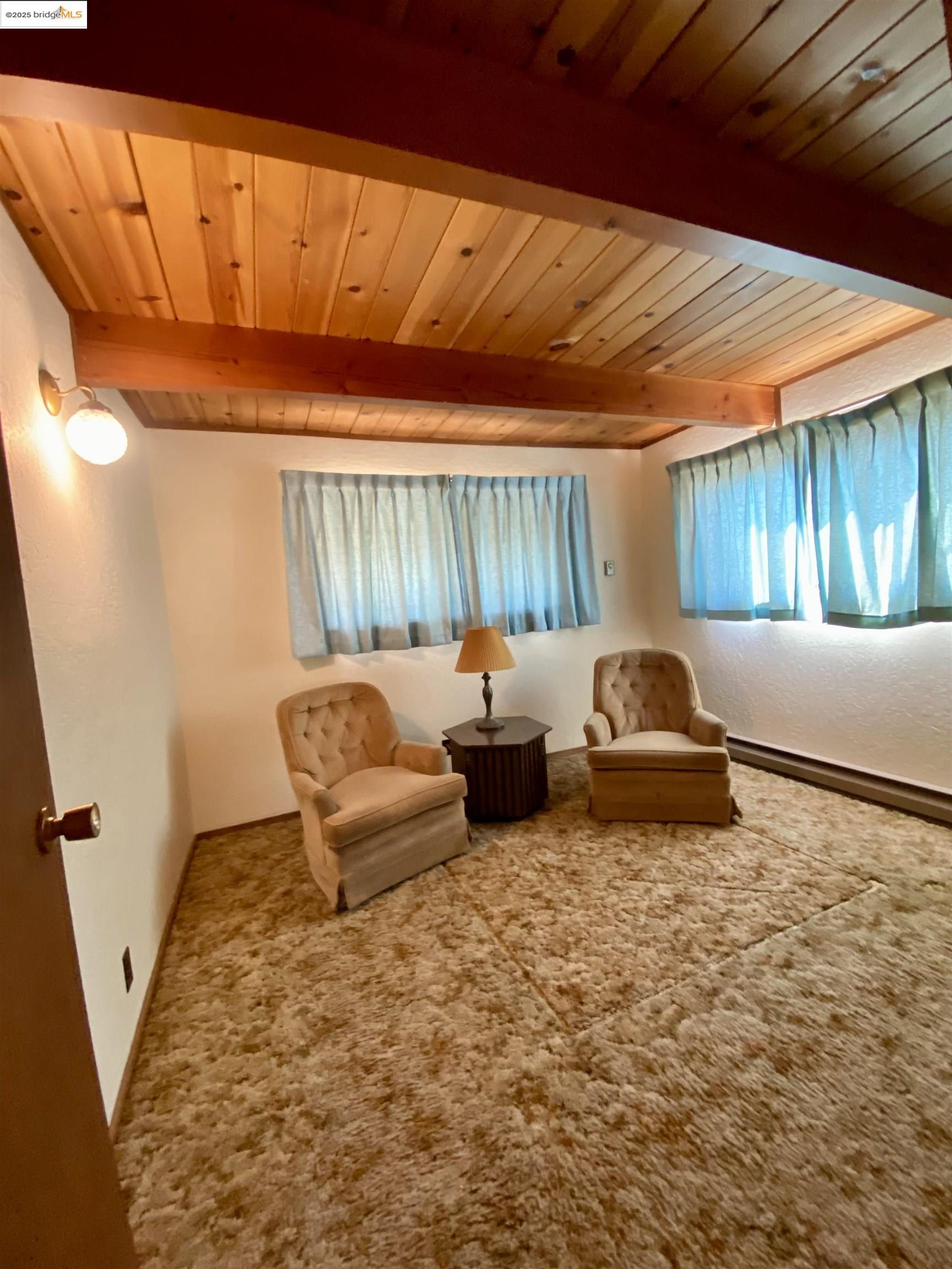 75 Poker Flat Road Copperopolis, CA 95228 - Photo 31 of 50 a bedroom with furniture and a window