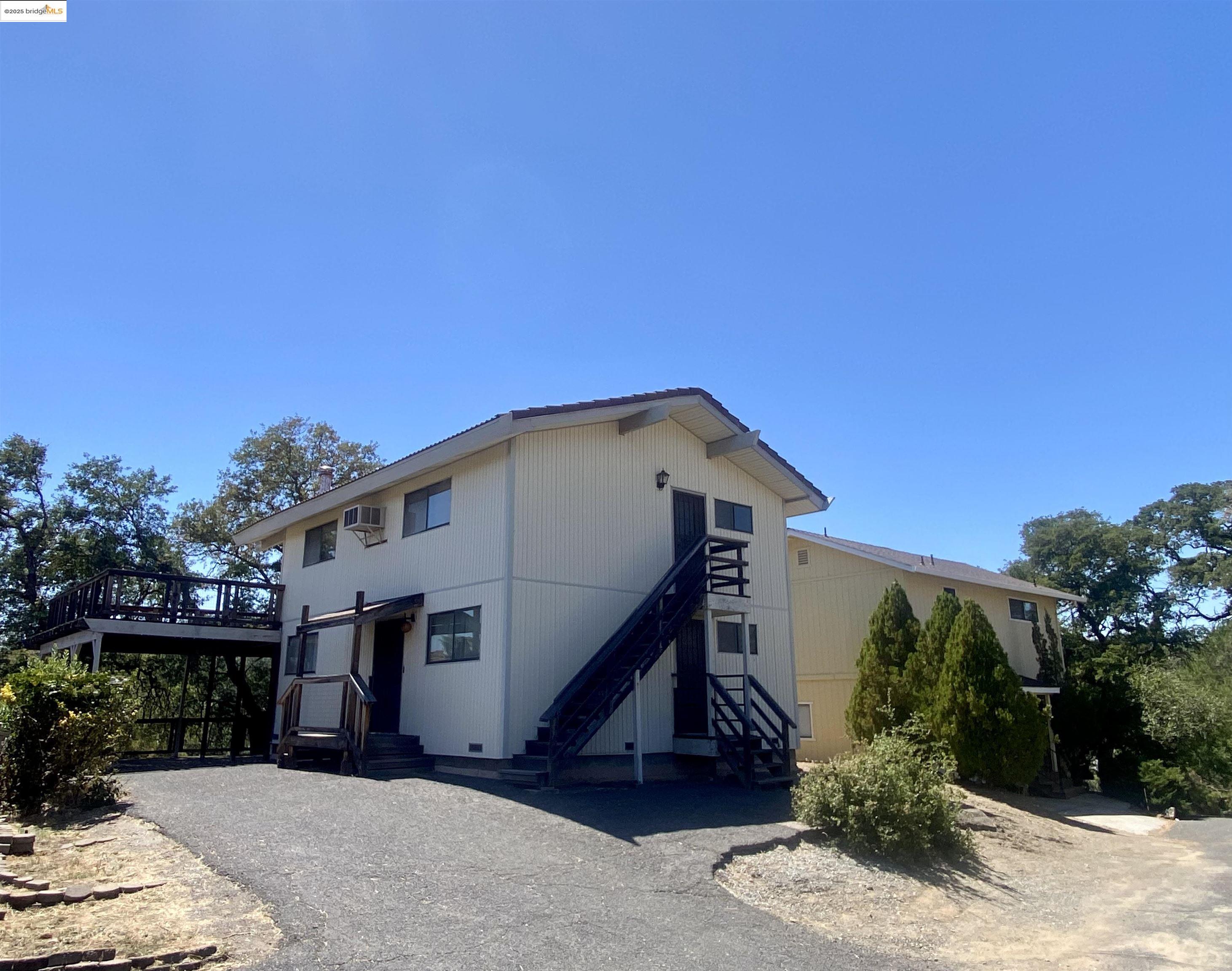 75 Poker Flat Road Copperopolis, CA 95228 - Photo 37 of 50 a front view of a house with a yard