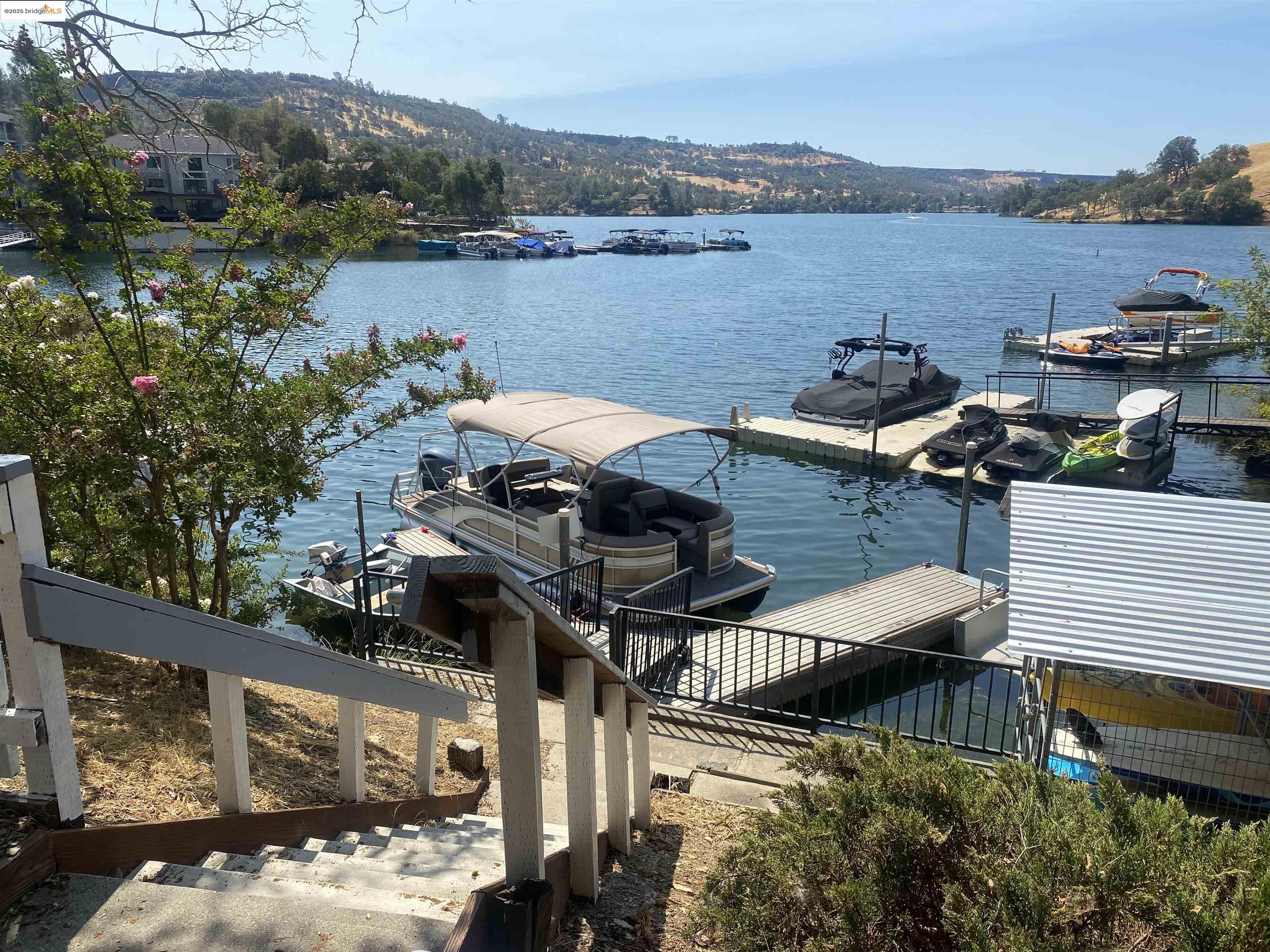 75 Poker Flat Road Copperopolis, CA 95228 - Photo 41 of 50 a view of a lake with a mountain in the background