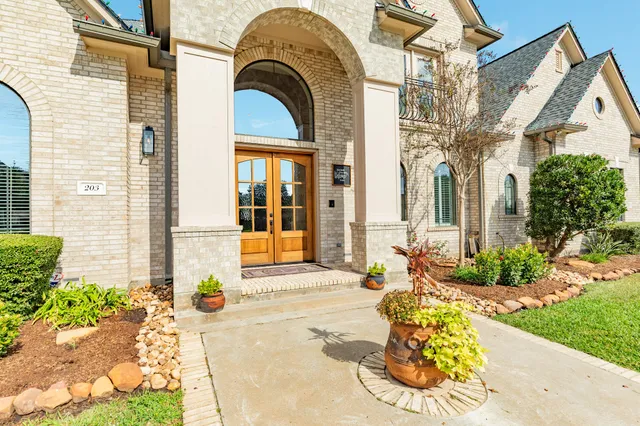 a view of hallway with wooden floor and stairs