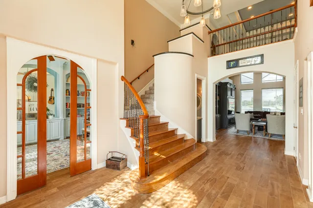 a bedroom with furniture and a rug