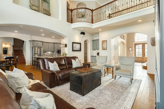 a kitchen with stainless steel appliances granite countertop a stove refrigerator and cabinets