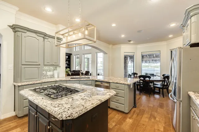 a view of a dining room with furniture and windows