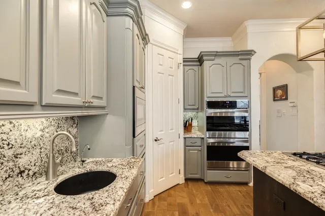 a bathroom with a toilet a sink and a mirror