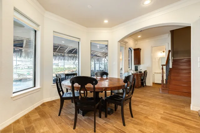 a spacious bathroom with a tub sink and mirror