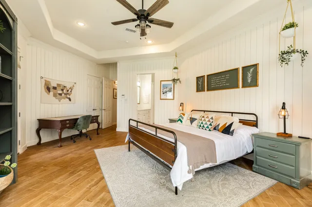 a bathroom with a tub shower and sink