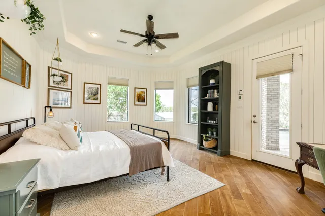 a view of staircase with railing and a chandelier