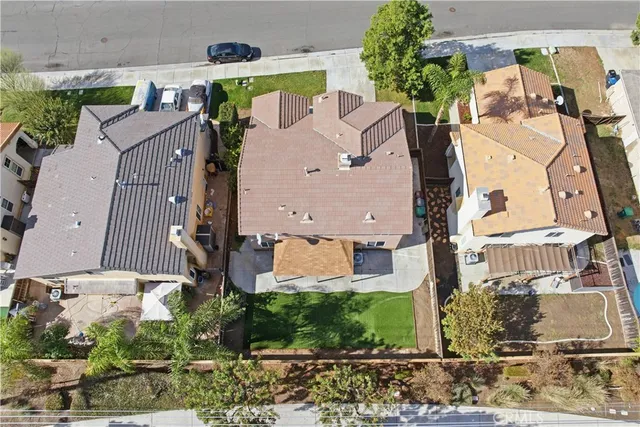 an aerial view of residential houses with outdoor space