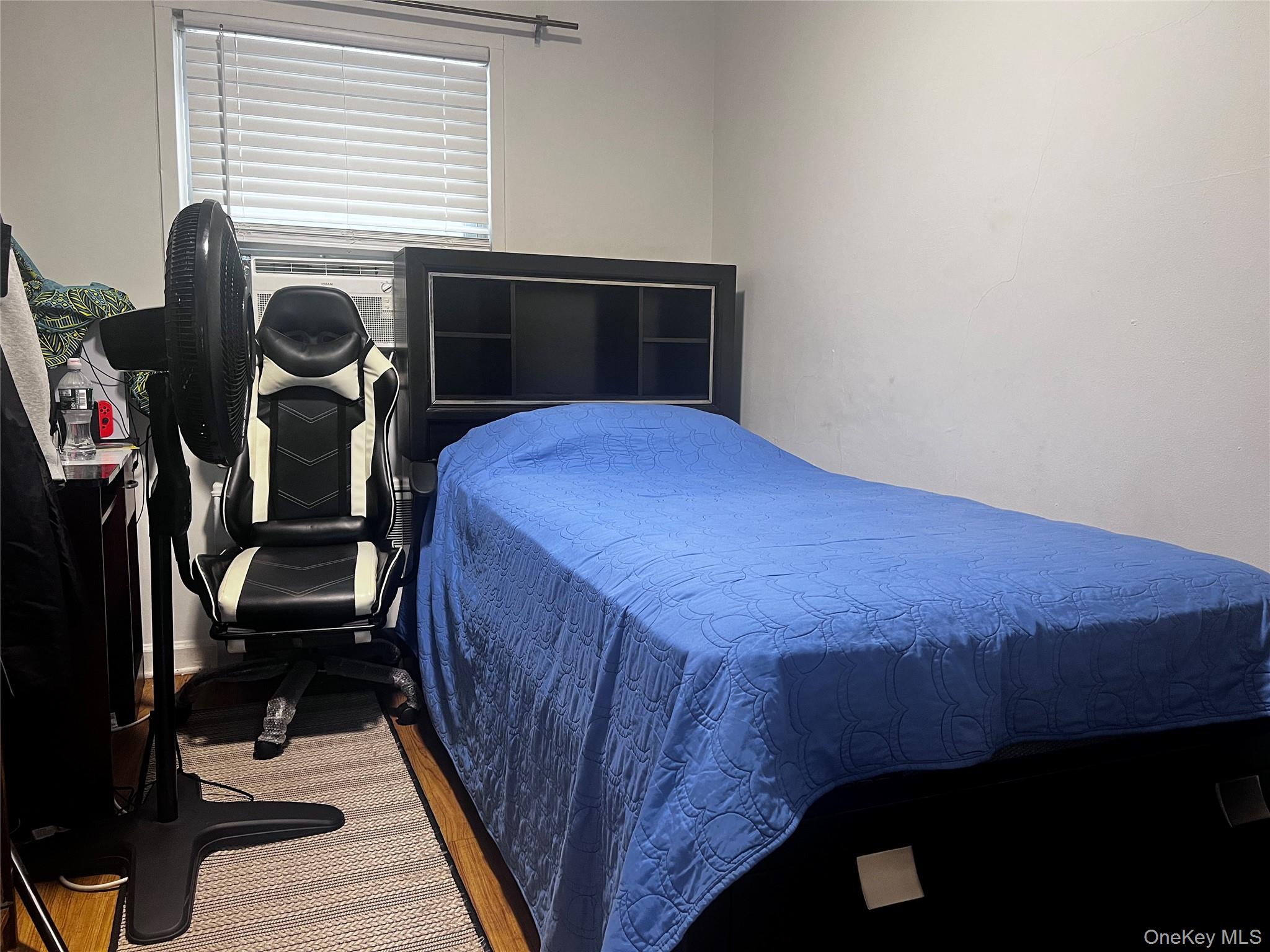 4153 Bruner Avenue Bronx, NY 10466 - Photo 11 of 13 a bedroom with a bed and a window