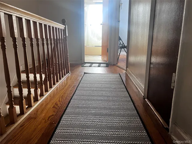 a view of balcony with wooden floor
