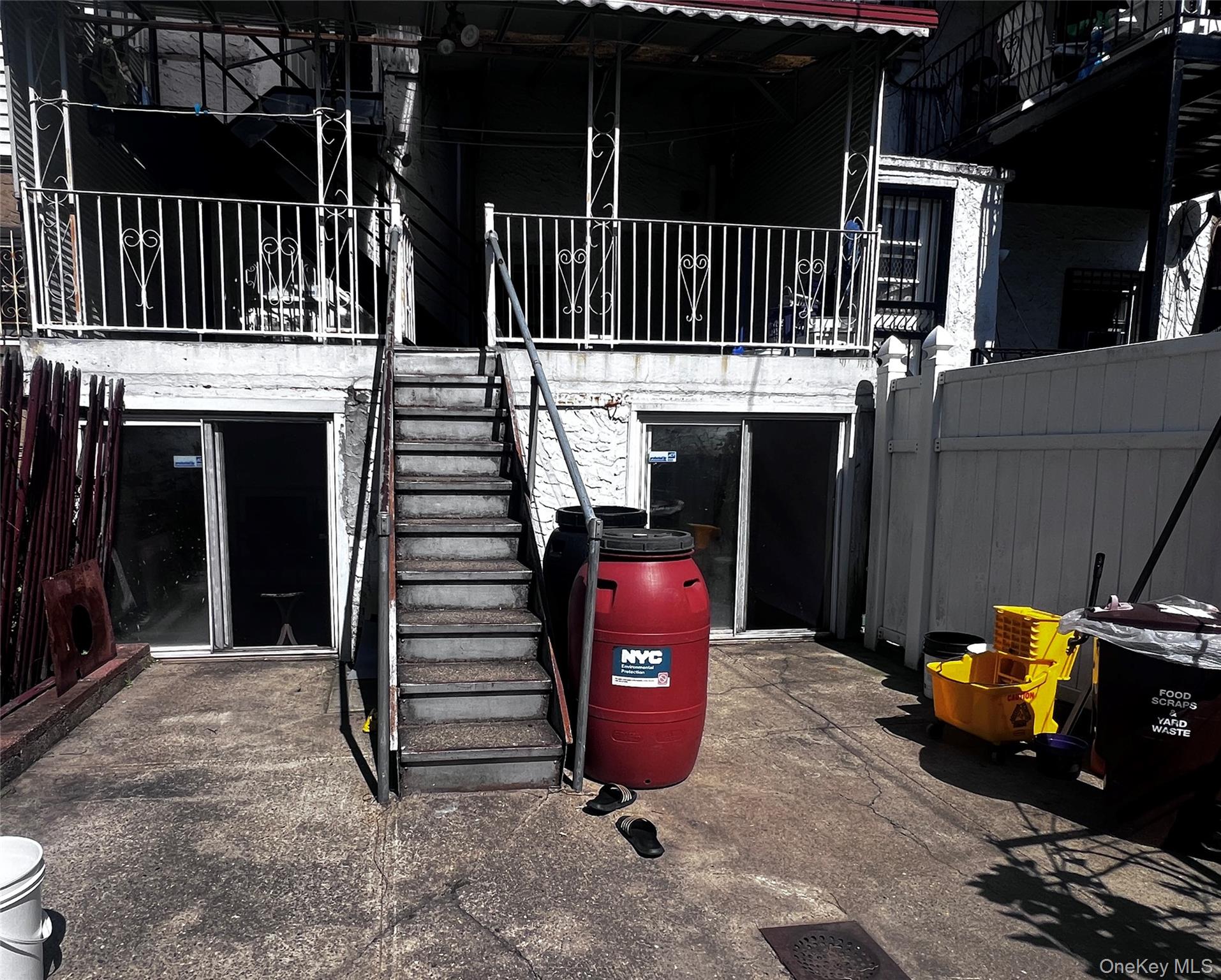 4153 Bruner Avenue Bronx, NY 10466 - Photo 13 of 13 a view of a patio with table and chairs with wooden floor and fence