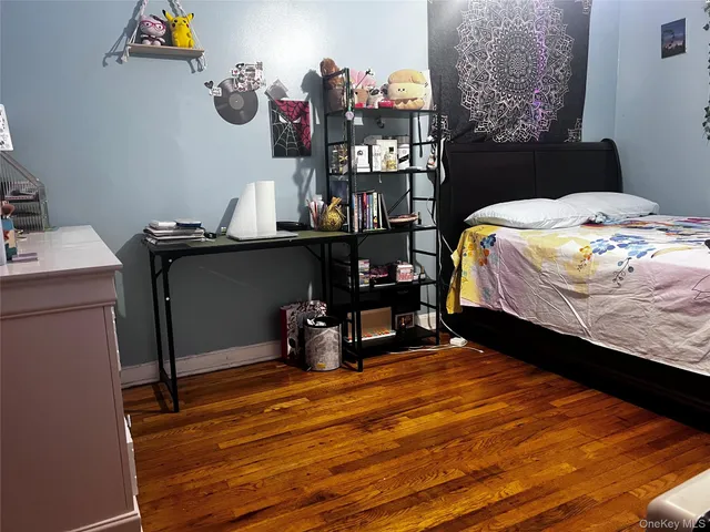 a bedroom with a bed and cabinets