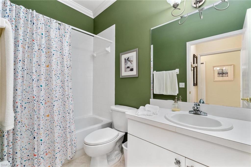 8610 Cedar Hammock Circle, Unit 1242 Naples, FL 34112 - Photo 12 of 50 a bathroom with a sink toilet and shower