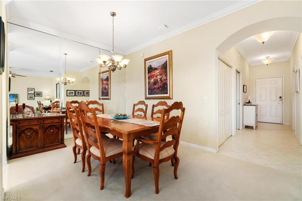 8610 Cedar Hammock Circle, Unit 1242 Naples, FL 34112 - Photo 20 of 50 a view of a dining room with furniture
