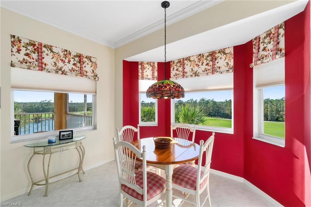 8610 Cedar Hammock Circle, Unit 1242 Naples, FL 34112 - Photo 28 of 50 a view of a dining room with furniture window and outside view
