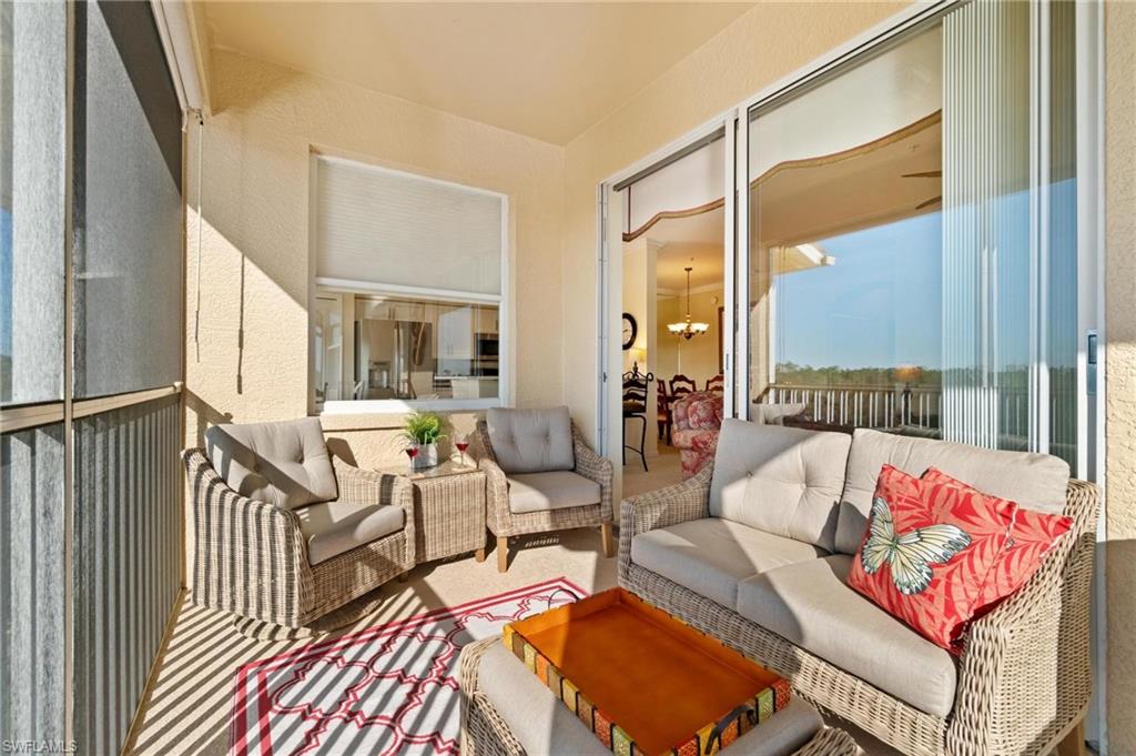 8610 Cedar Hammock Circle, Unit 1242 Naples, FL 34112 - Photo 37 of 50 a living room with furniture
