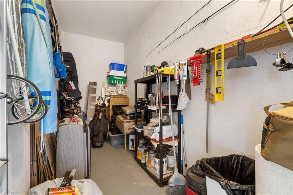 8610 Cedar Hammock Circle, Unit 1242 Naples, FL 34112 - Photo 39 of 50 a view of walk in closet with clothes and shoes