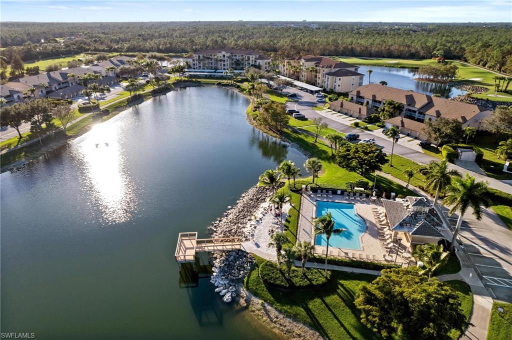 8610 Cedar Hammock Circle, Unit 1242 Naples, FL 34112 - Photo 44 of 50 a view of a lake with a mountain view