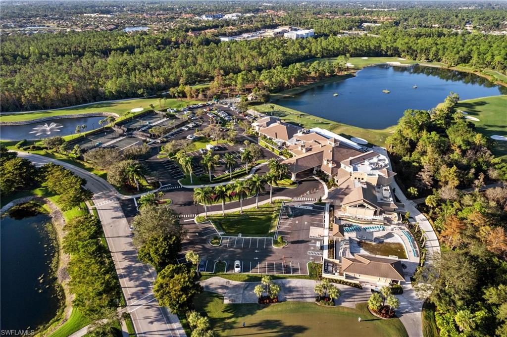 8610 Cedar Hammock Circle, Unit 1242 Naples, FL 34112 - Photo 45 of 50 an aerial view of residential houses with outdoor space
